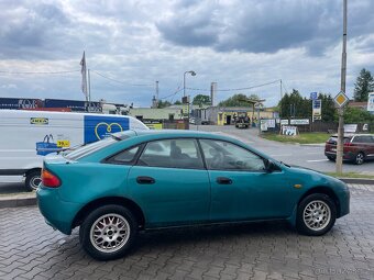Mazda 323f 1.5 66 KW DOHC. Klima, el.okna, ALU kola - 8