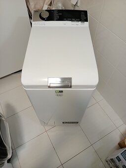 Pračka AEG s vrchním plněním a párou - 8