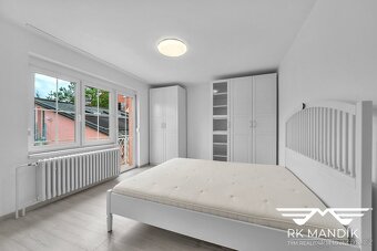 Prodej rodinného domu s garáží dílnou a zahradou - Praha - K - 8