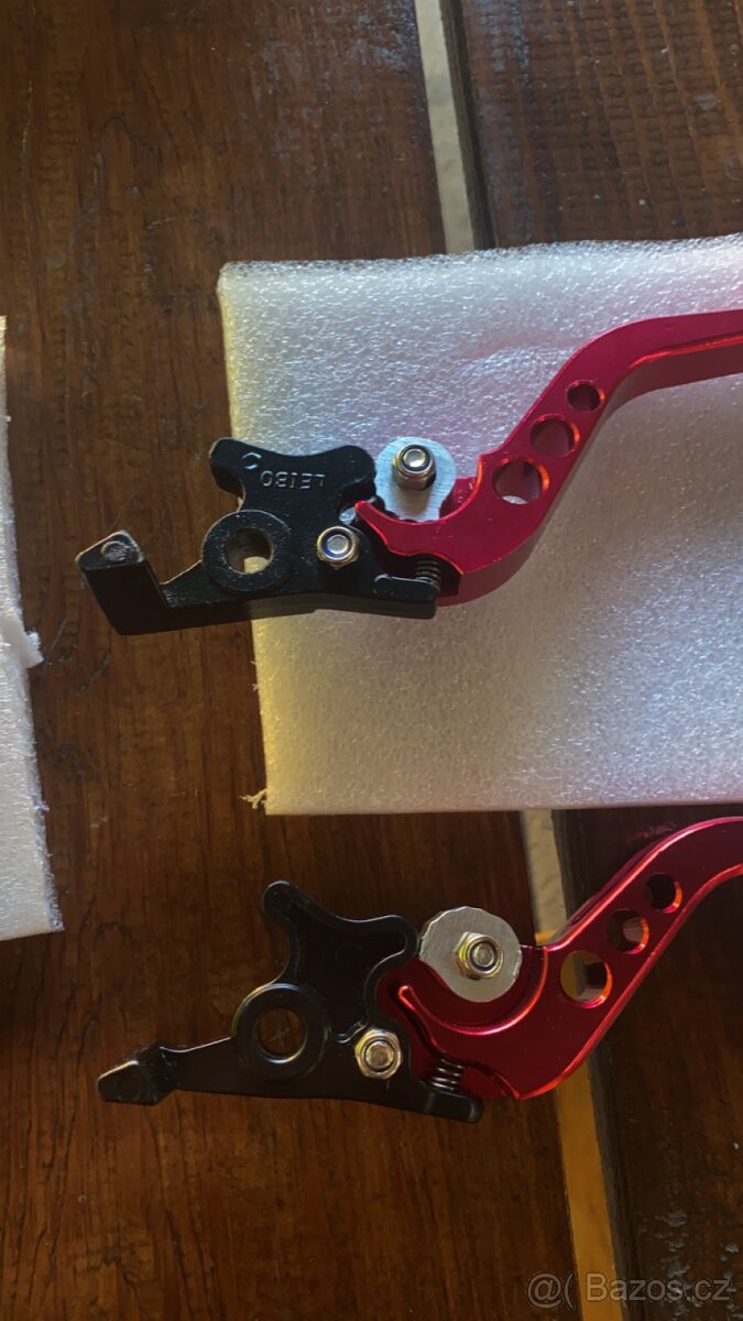 Držák na mobil,závažíčka do řídítek ,páčky - 9