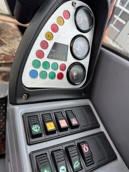 Kolový otočný bagr TEREX TW 110 - 9