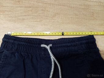 2x kalhoty HM vel. 128 - 9