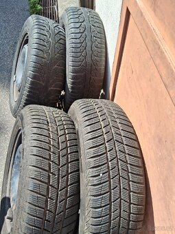 Zimní pneumatiky na plechových kolech R15 195/65 H - 9
