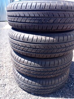 Sada kol 4x100, ET 35 vč. pneu Falken 165/70 R 14 - 9