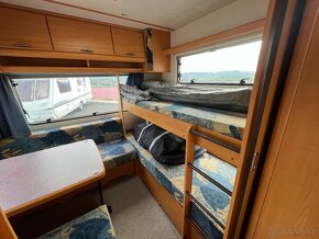 LMC 495 K - markýza, předstan, držák kol, palandy - 9