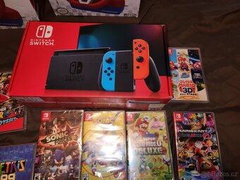 Prodám Nintendo Switch + 2xvolant a 15 her - 9
