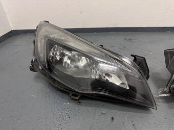 Opel Astra J přední část vozidla kapota blatníky světla - 9